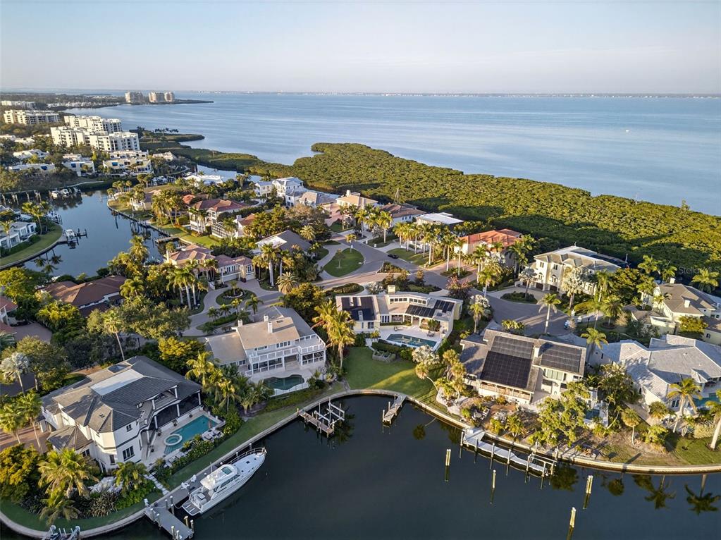 1571 Harbor Cay Lane Longboat Key, FL 34228 - Photo 82 of 93 an aerial view of residential houses with outdoor space