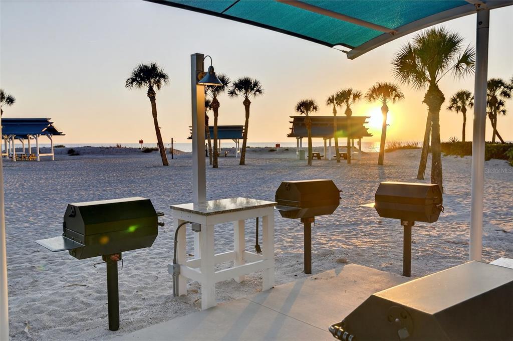 1571 Harbor Cay Lane Longboat Key, FL 34228 - Photo 89 of 93 a view of a chairs and table in the patio
