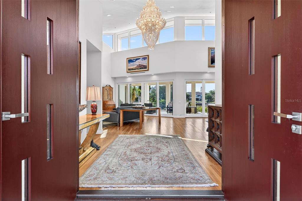 1571 Harbor Cay Lane Longboat Key, FL 34228 - Photo 10 of 93 a living room with stainless steel appliances kitchen island granite countertop furniture and a rug