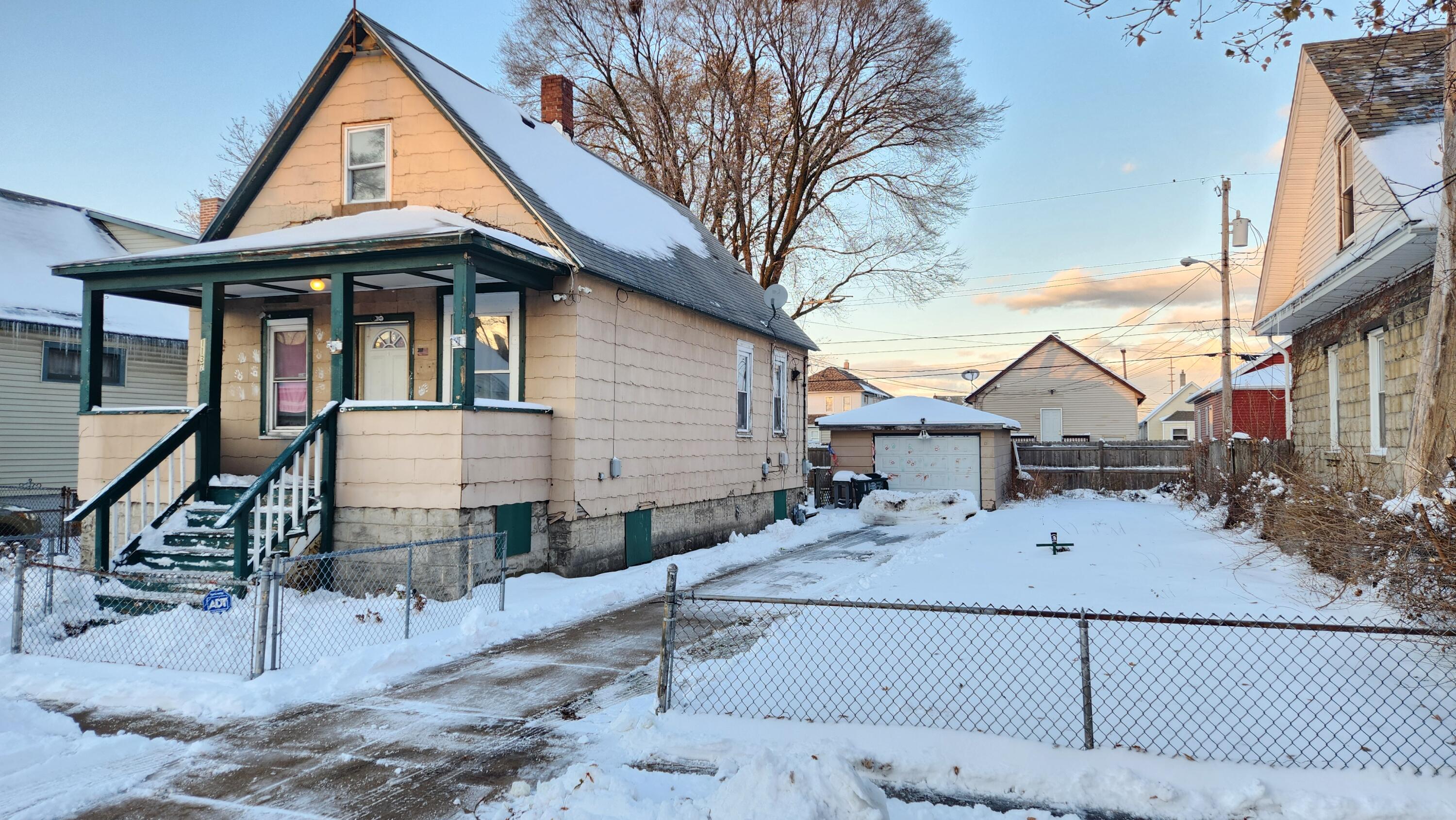 1137 Indiana Street Hammond, IN 46320 - Photo 1 of 13 a view of a house with wooden fence