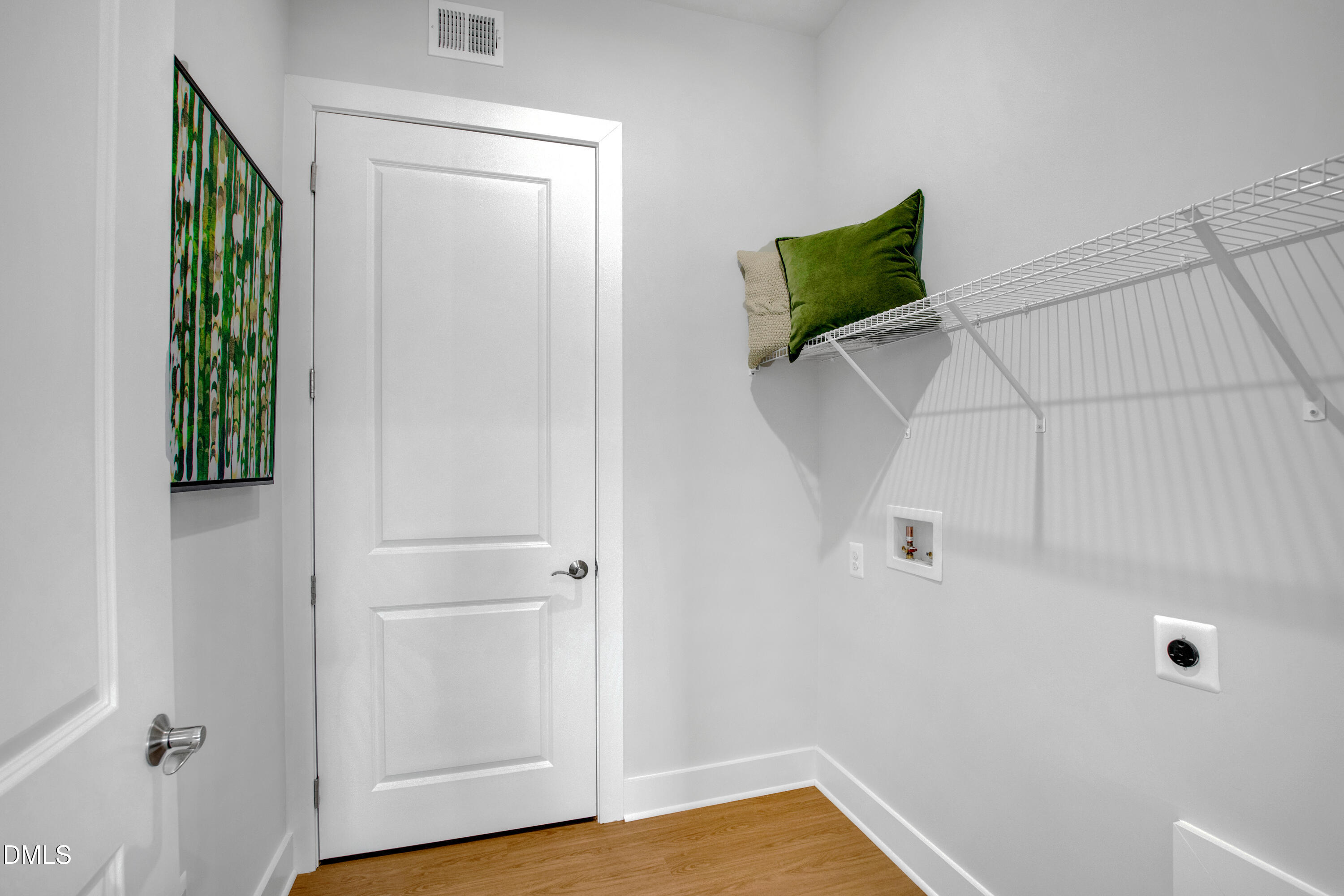 2119 Barrier Ridge Way Apex, NC 27502 - Photo 6 of 38 a view of a room with wooden floor and cabinet