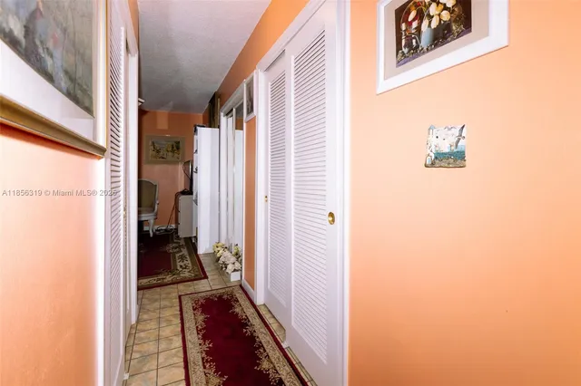 a kitchen with granite countertop a sink cabinets and window