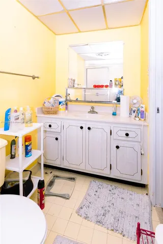 a bedroom with furniture and a rug