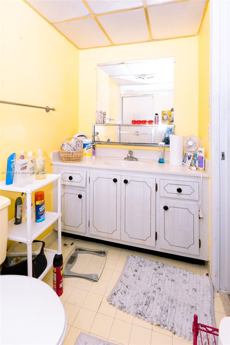 619 Northeast 14th Avenue, Unit 507 Hallandale Beach, FL 33009 - Photo 12 of 31 a kitchen with granite countertop a sink cabinets and window