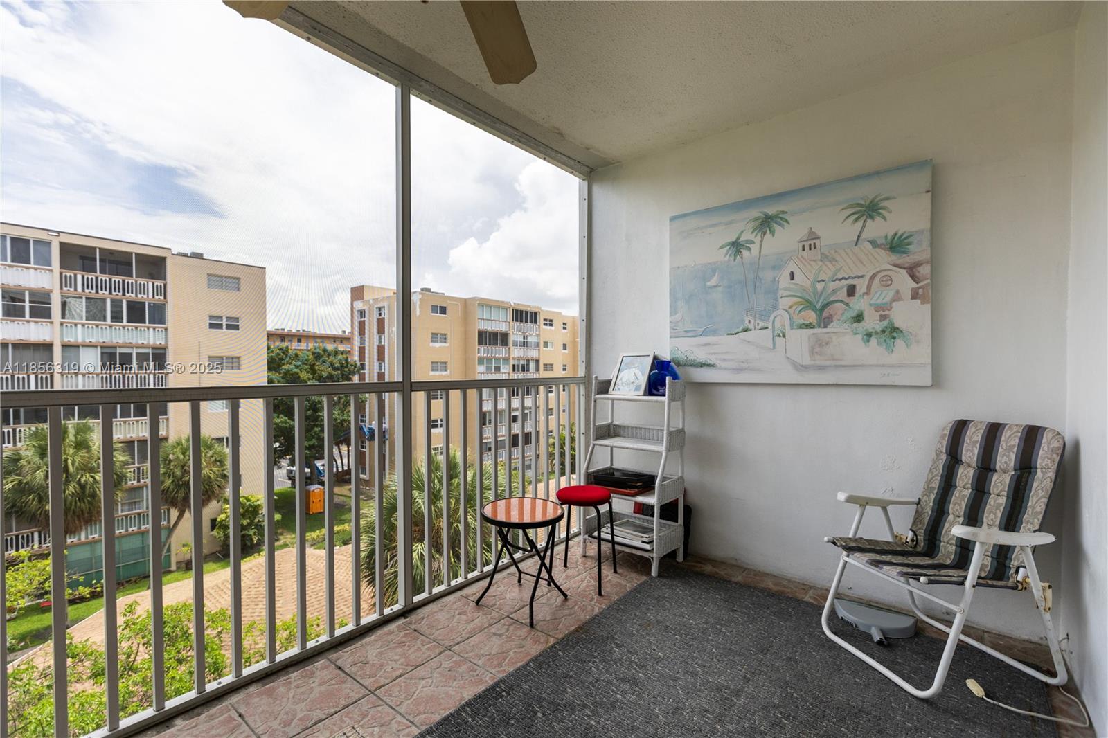 619 Northeast 14th Avenue, Unit 507 Hallandale Beach, FL 33009 - Photo 18 of 31 a view of a balcony with chairs