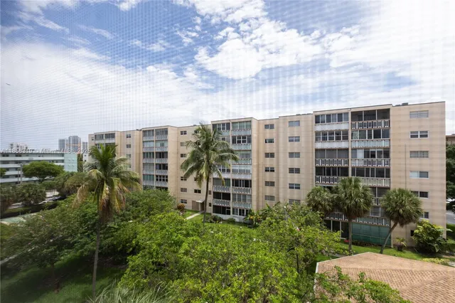a view of a hallway with couches and painted walls