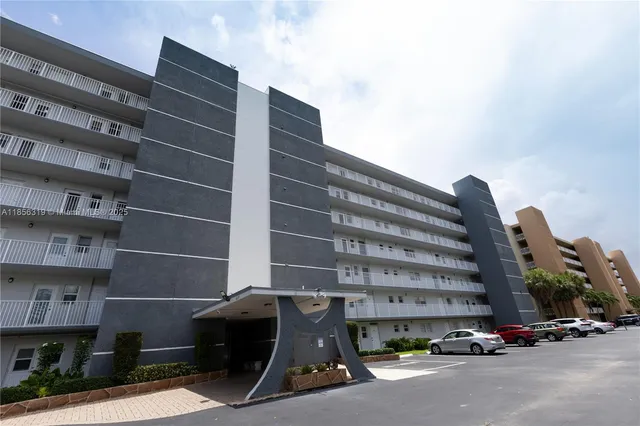 a view of cars parked in front of a building