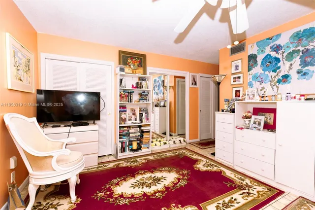 a room with furniture and a flat screen tv