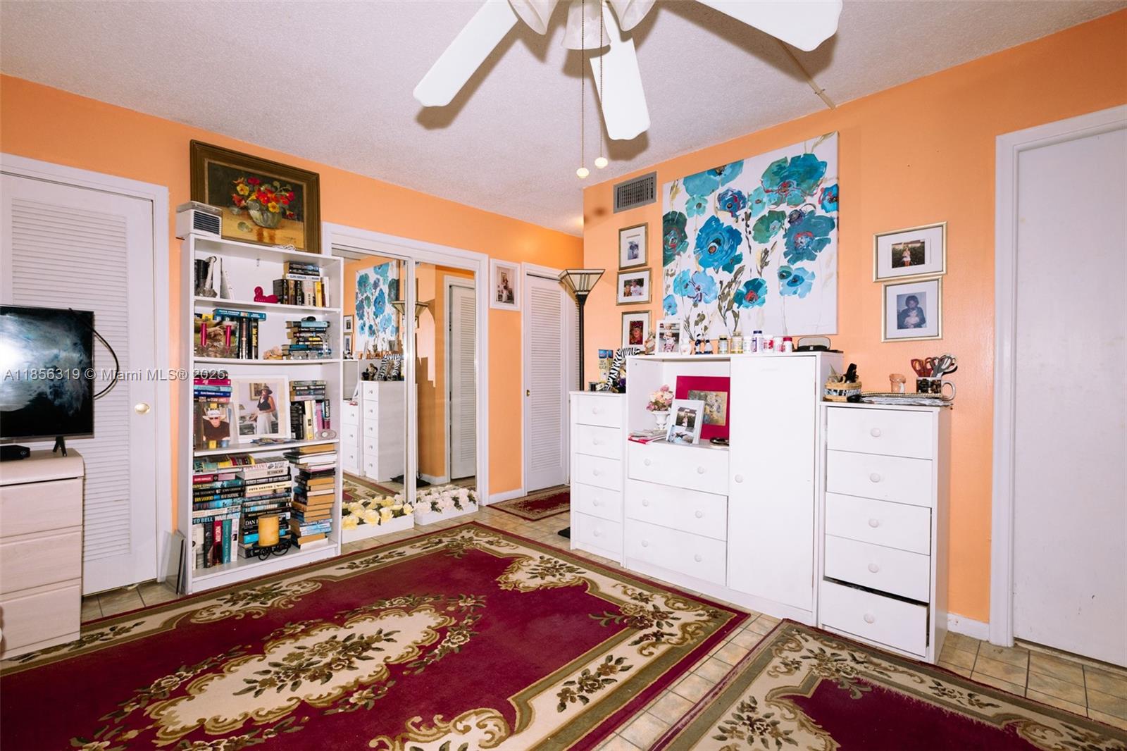 619 Northeast 14th Avenue, Unit 507 Hallandale Beach, FL 33009 - Photo 9 of 31 a room with furniture and a flat screen tv