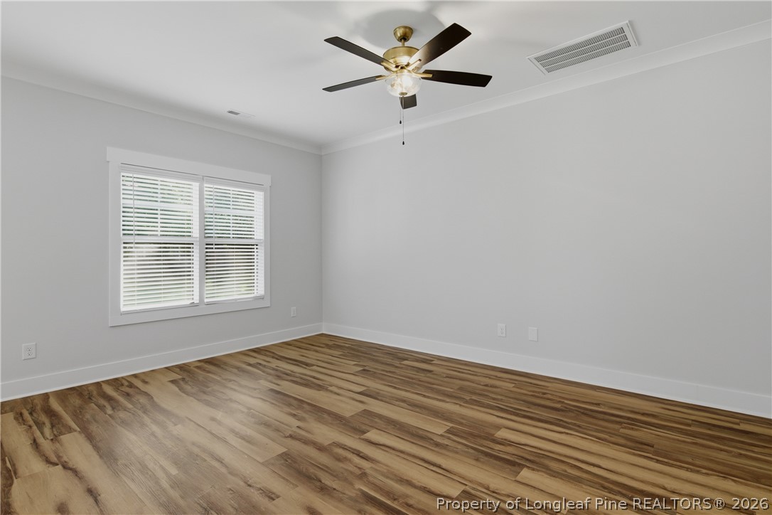 3931 Hamilton Street Hope Mills, NC 28348 - Photo 13 of 50 wooden floor in an empty room with a window