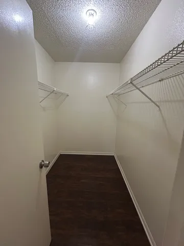 a view of a room with racks on the wall