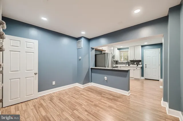 a white refrigerator freezer sitting inside of a kitchen