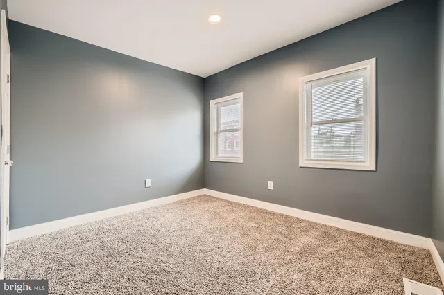 a room with mirror and window