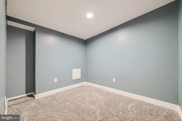 a view of hallway with wooden floor