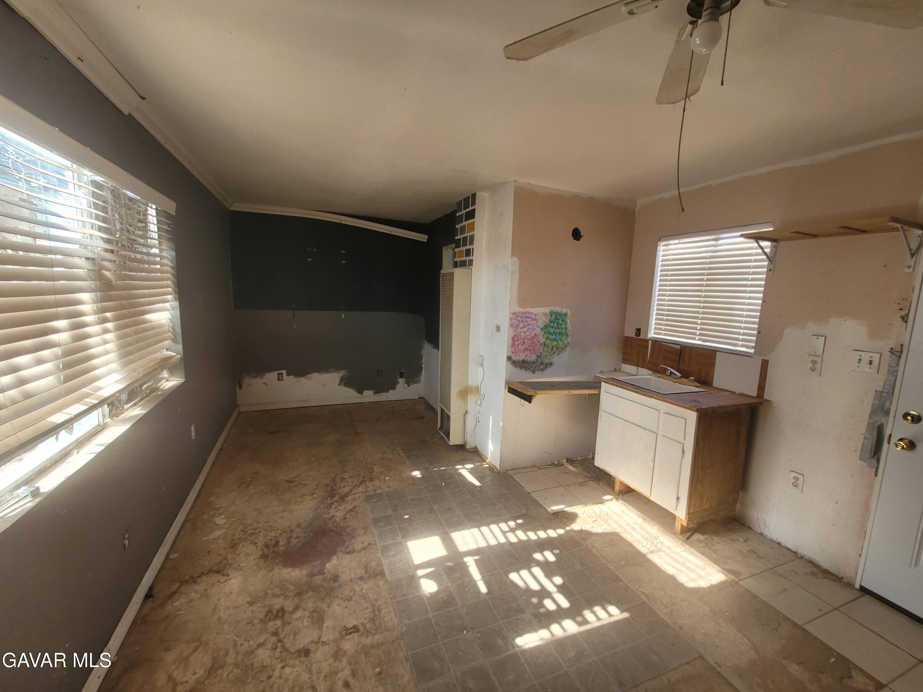 13420 Gilbert Street North Edwards, CA 93523 - Photo 18 of 20 a bathroom with a sink toilet and shower