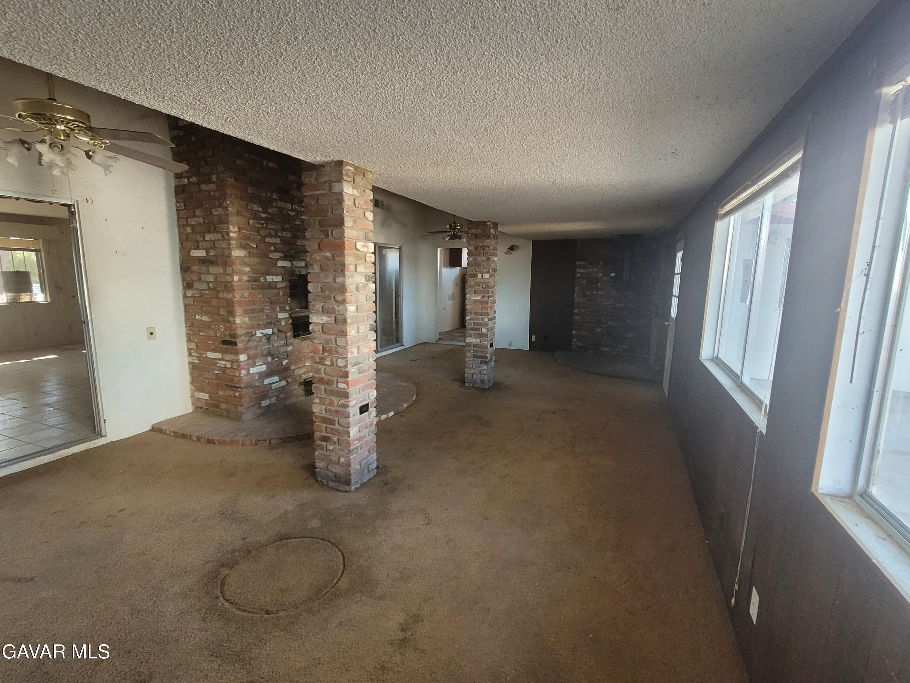 13420 Gilbert Street North Edwards, CA 93523 - Photo 5 of 20 an empty room with windows