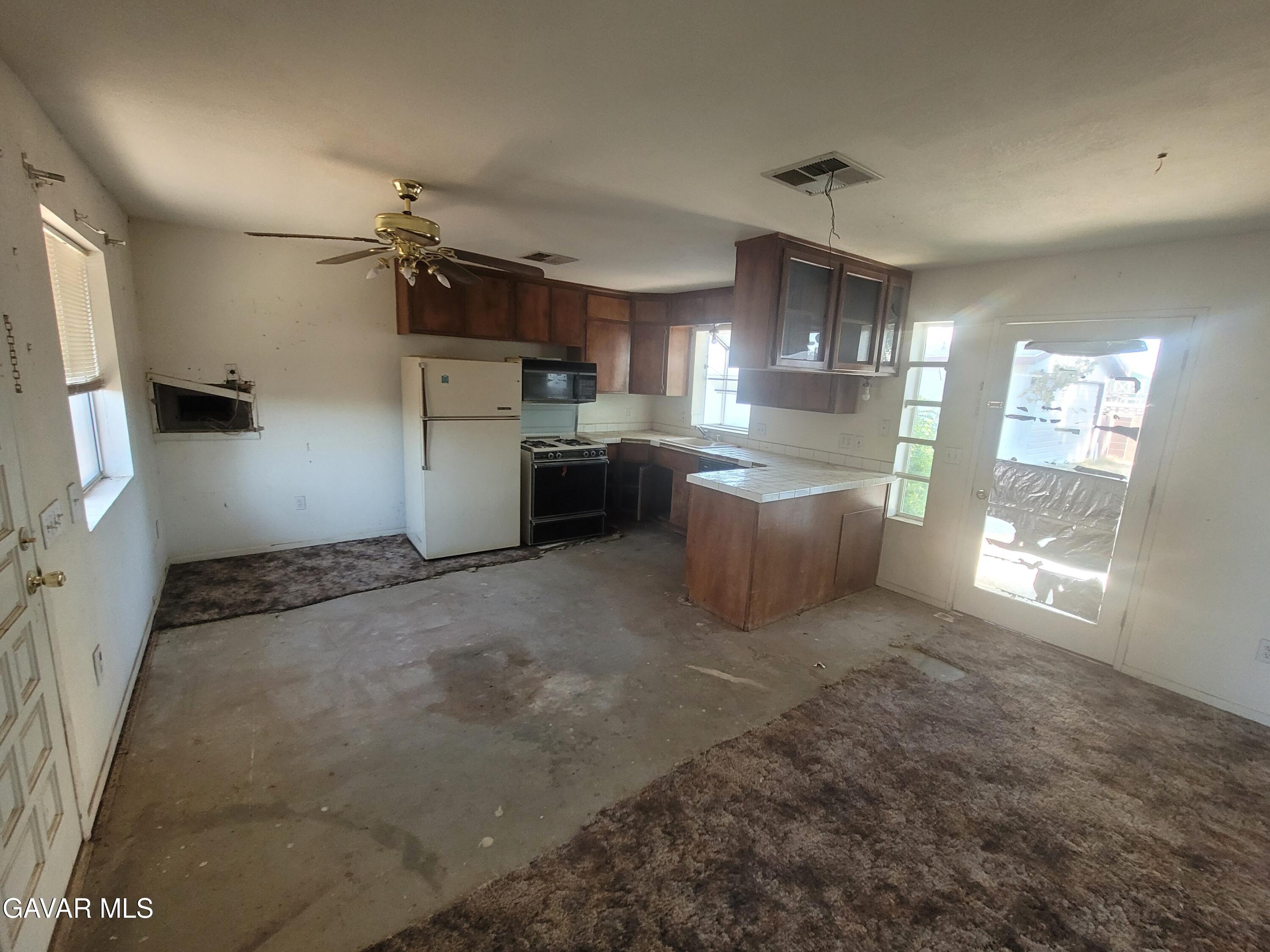 13420 Gilbert Street North Edwards, CA 93523 - Photo 8 of 20 a room with furniture and a window