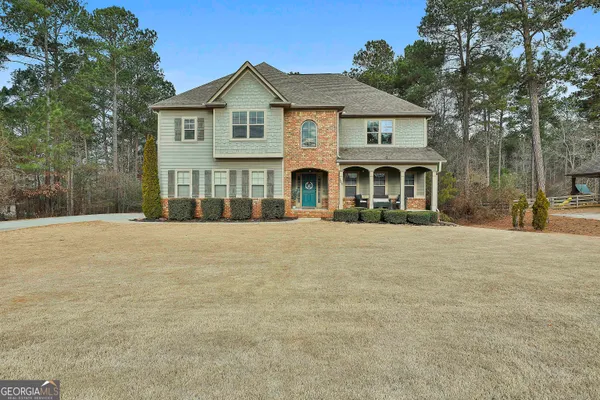 a view of a house with a snow in the yard