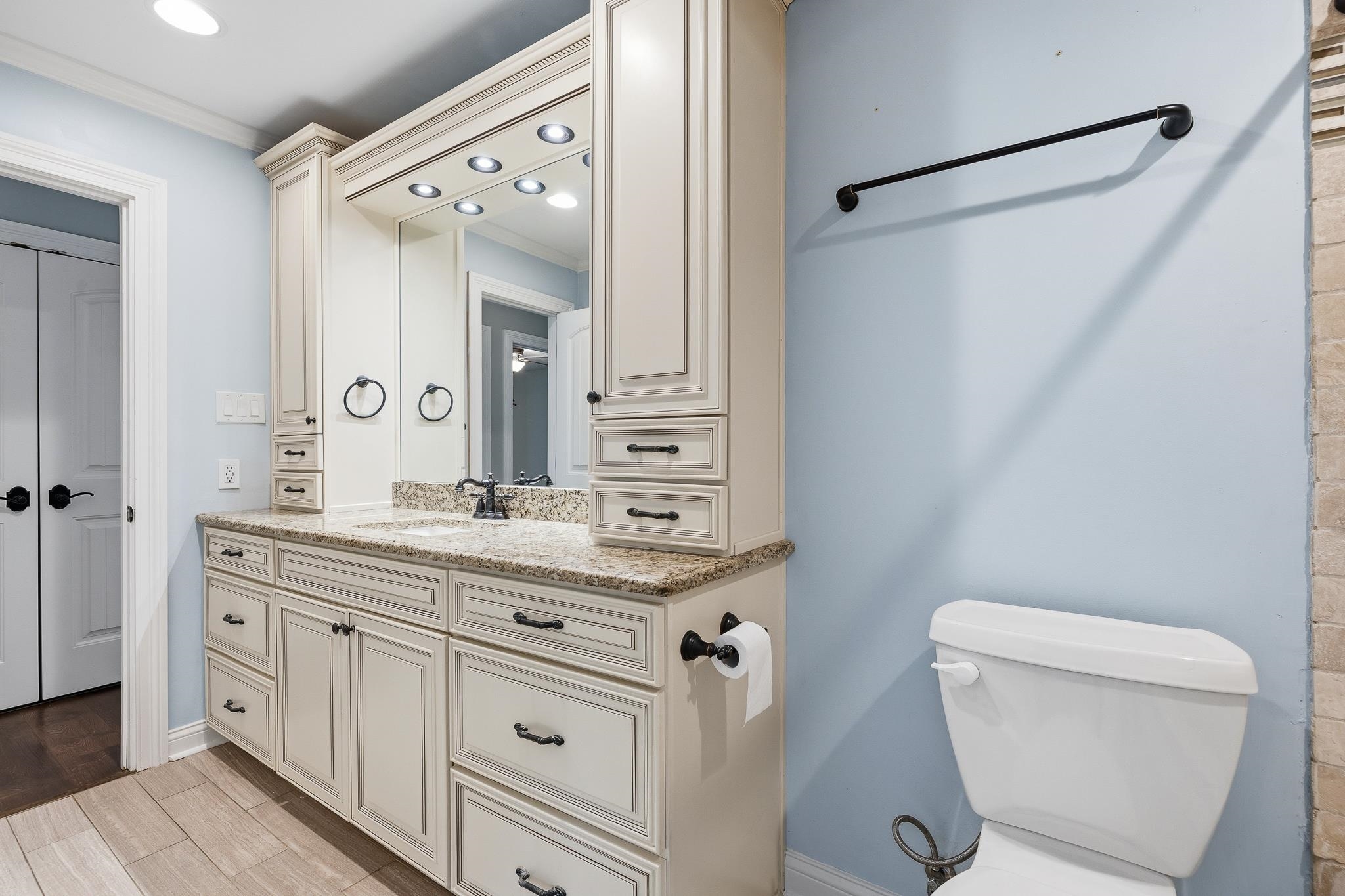 1234 Greenview Road Collierville, TN 38017 - Photo 19 of 33 a bathroom with a granite countertop sink a toilet and a mirror