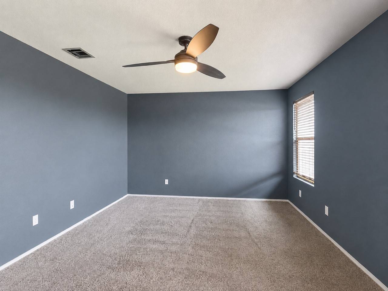 116 Night Riders Way Jarrell, TX 76537 - Photo 20 of 38 A comfortable bedroom features carpet flooring and a window for natural light.
