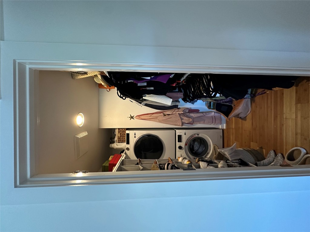 2200 Dickson Drive, Unit 216 Austin, TX 78704 - Photo 7 of 10 a view of walk in closet with clothes and shoes