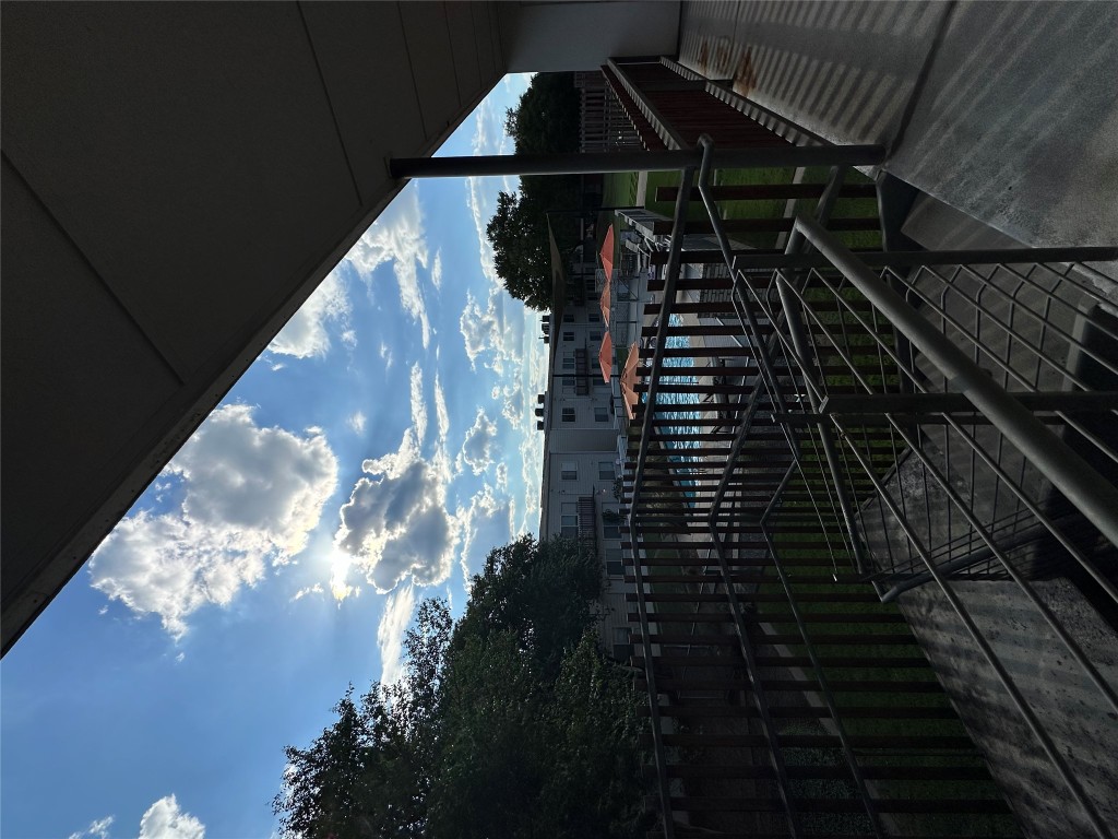 2200 Dickson Drive, Unit 216 Austin, TX 78704 - Photo 10 of 10 a view of a balcony with wooden fence