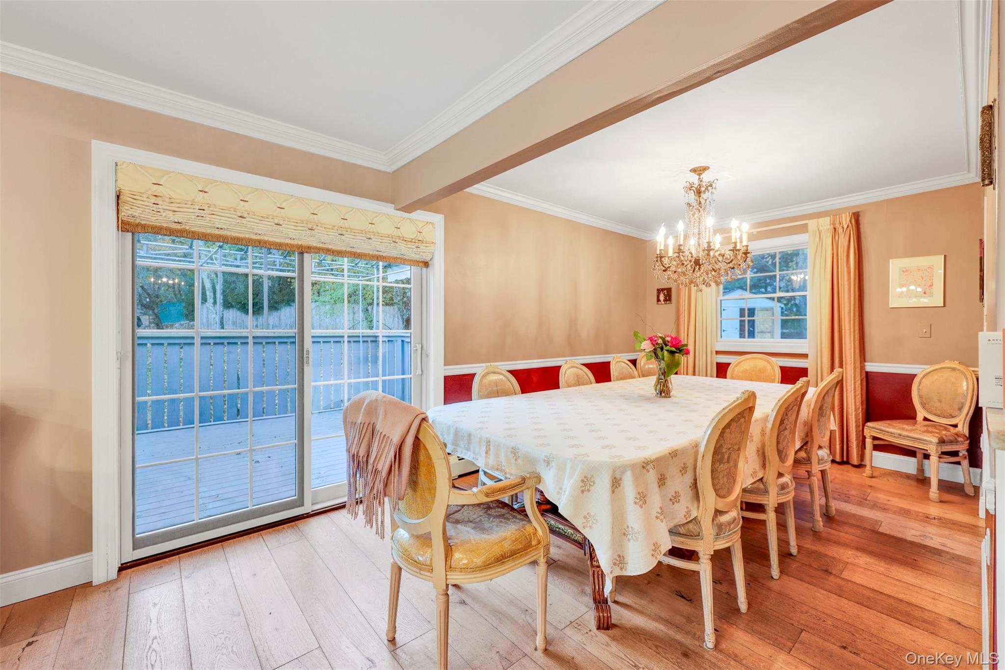 3 Kakiat Lane Spring Valley, NY 10977 - Photo 13 of 44 a view of a dining room with furniture wooden floor and chandelier