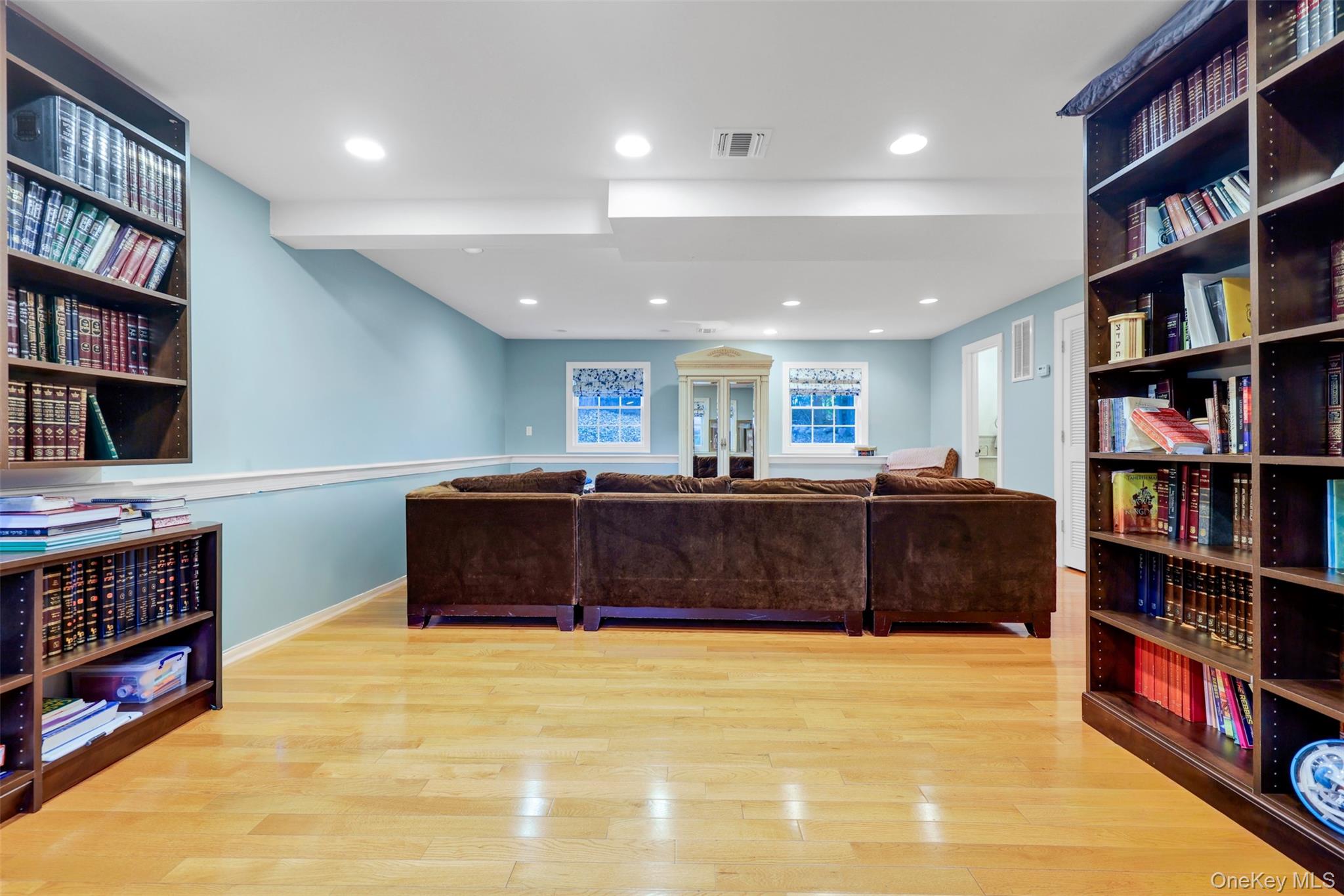 3 Kakiat Lane Spring Valley, NY 10977 - Photo 36 of 44 a living room with a couch and a book shelf