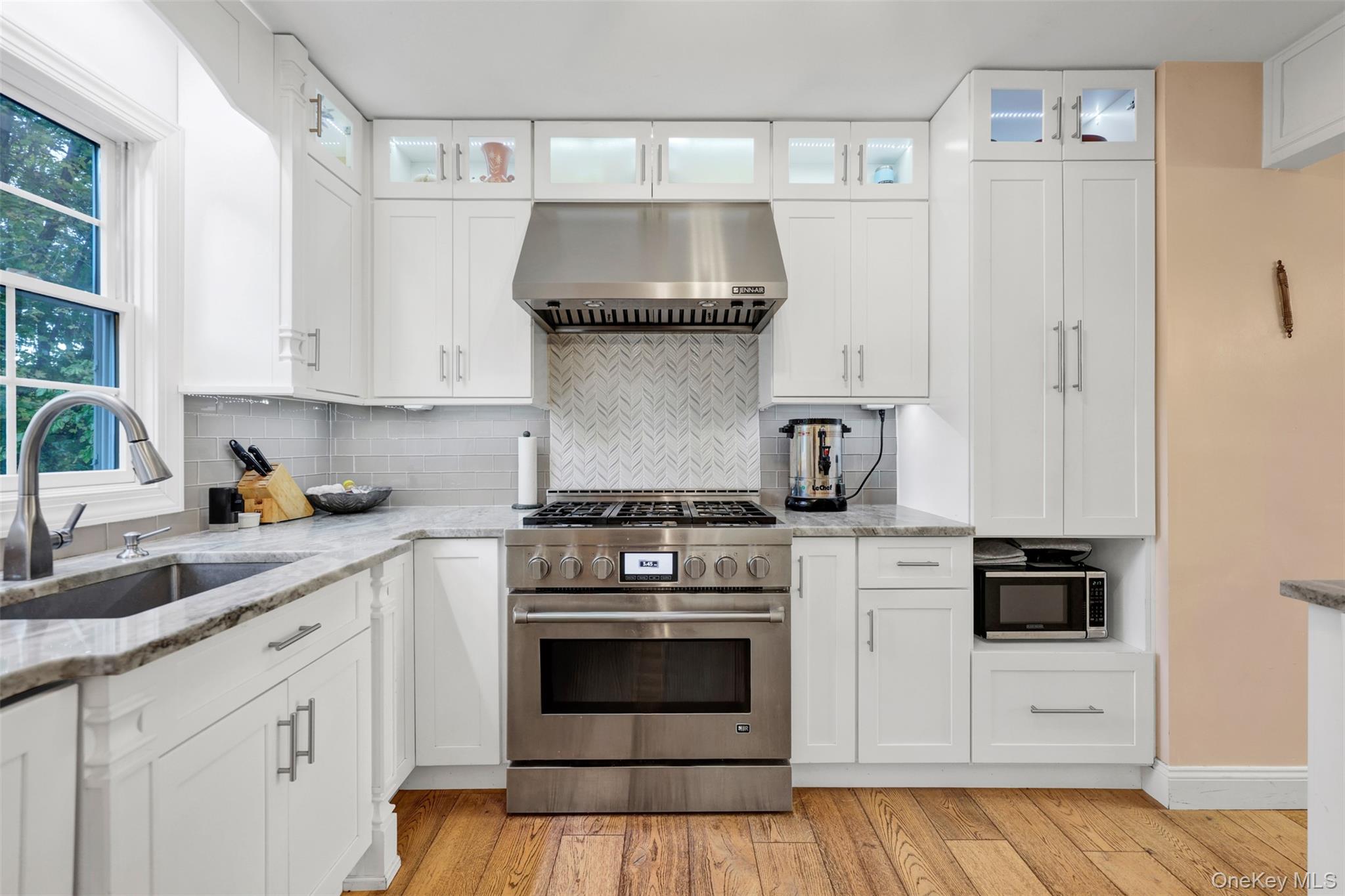 3 Kakiat Lane Spring Valley, NY 10977 - Photo 5 of 44 a kitchen with a stove and white cabinets