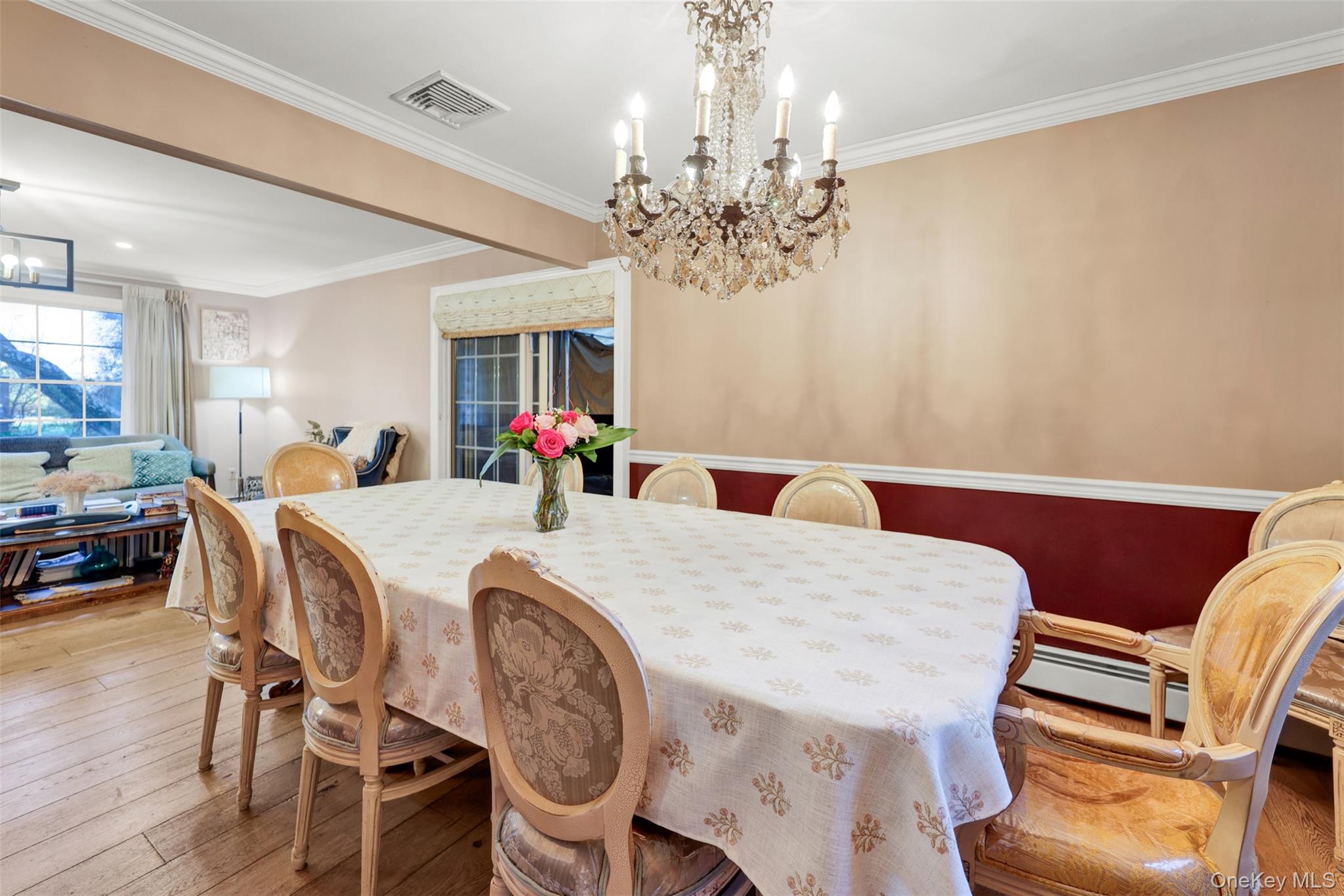 3 Kakiat Lane Spring Valley, NY 10977 - Photo 10 of 44 a view of a dining room with furniture and chandelier