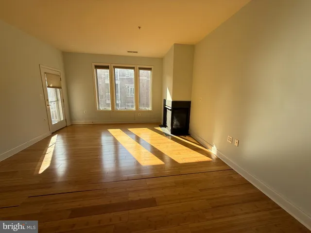 a bathroom with a double vanity sink mirror and toilet