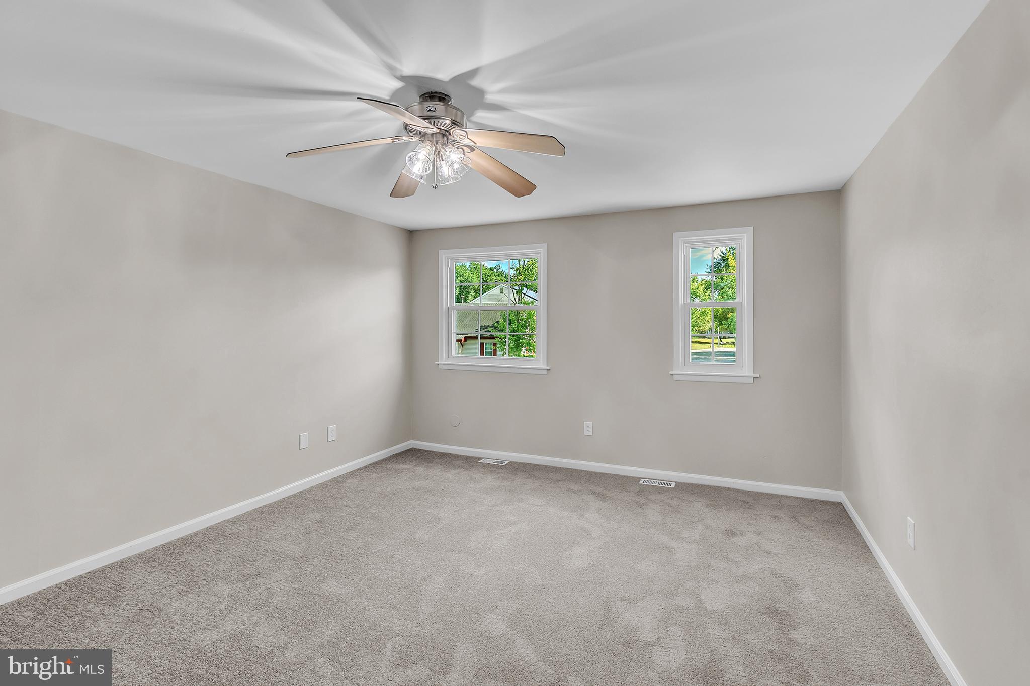 55 Hamilton Street Swedesboro, NJ 08085 - Photo 34 of 48 an empty room with windows and chandelier fan