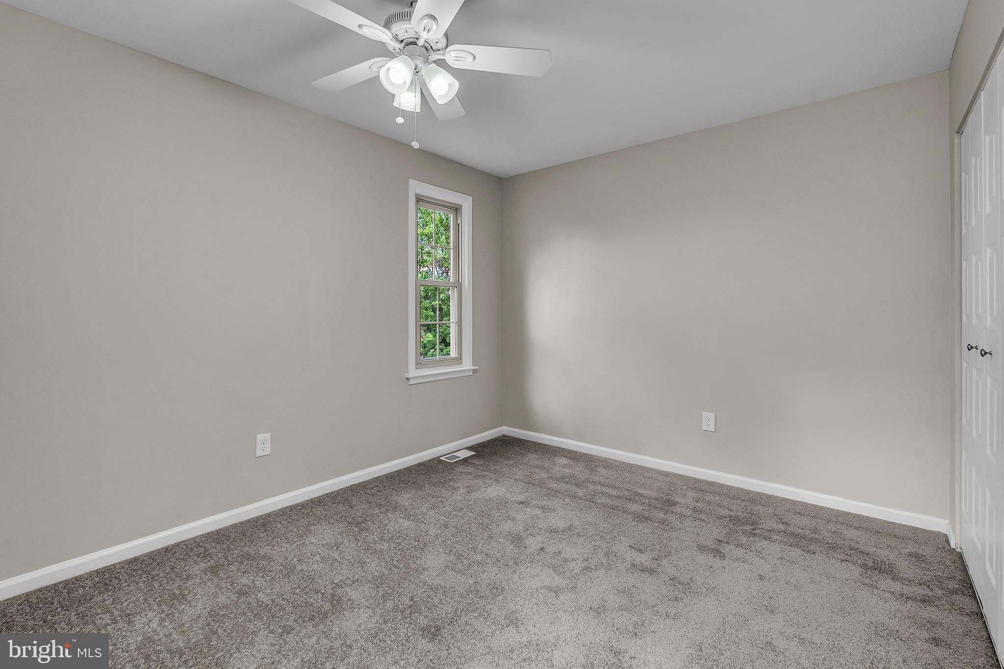 55 Hamilton Street Swedesboro, NJ 08085 - Photo 37 of 48 an empty room with windows and fan