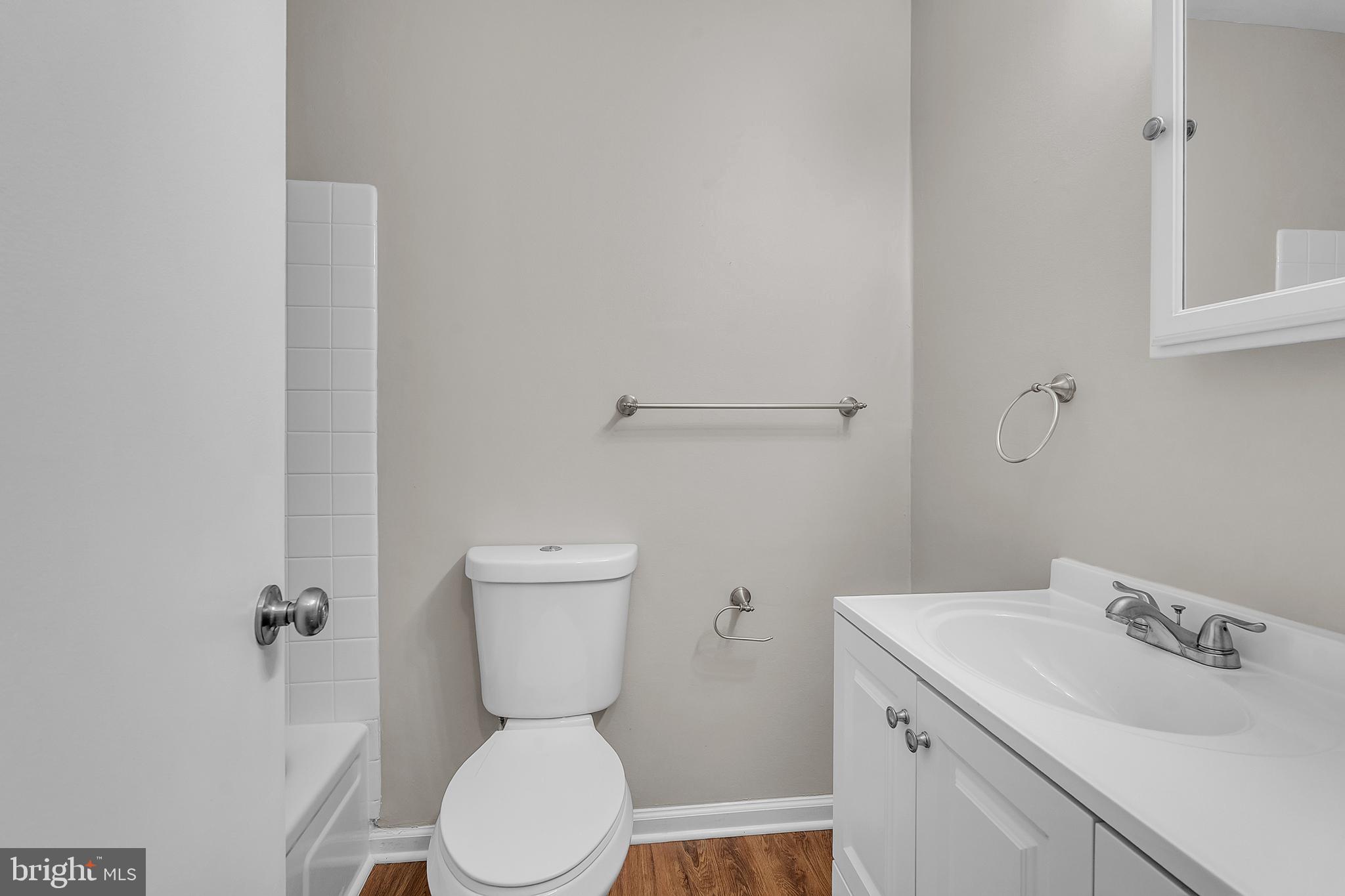 55 Hamilton Street Swedesboro, NJ 08085 - Photo 39 of 48 a bathroom with a toilet sink and mirror