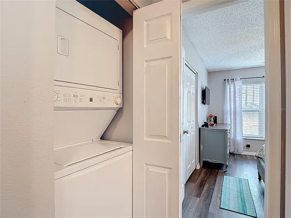a bedroom with furniture and large windows