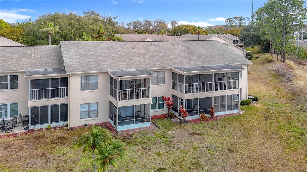 7828 Hardwick Drive, Unit 916 New Port Richey, FL 34653 - Photo 39 of 40 an aerial view of a house with a yard