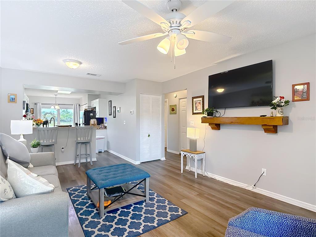 7828 Hardwick Drive, Unit 916 New Port Richey, FL 34653 - Photo 6 of 40 a living room with furniture and a flat screen tv
