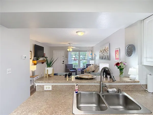 a kitchen with stainless steel appliances a white stove top oven and a refrigerator