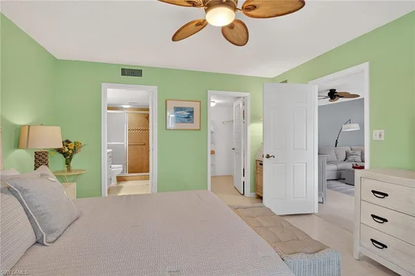 a bedroom with a bed and dresser