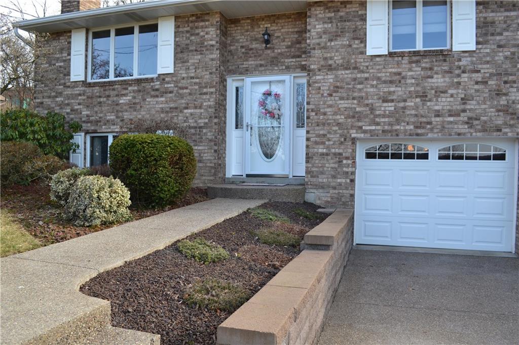 60 Windcrest Drive Cecil, PA 15321 - Photo 2 of 25 Welcome to 60 Windcrest Dive! Aggregate Concrete sidewalk.