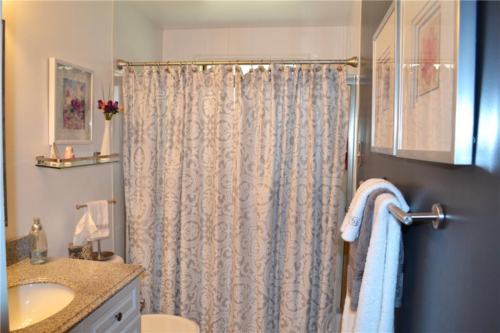 60 Windcrest Drive Cecil, PA 15321 - Photo 19 of 25 Main Floor bathroom boasts high end finishes! Tile floors, shower doors, vanity with granite counter top!