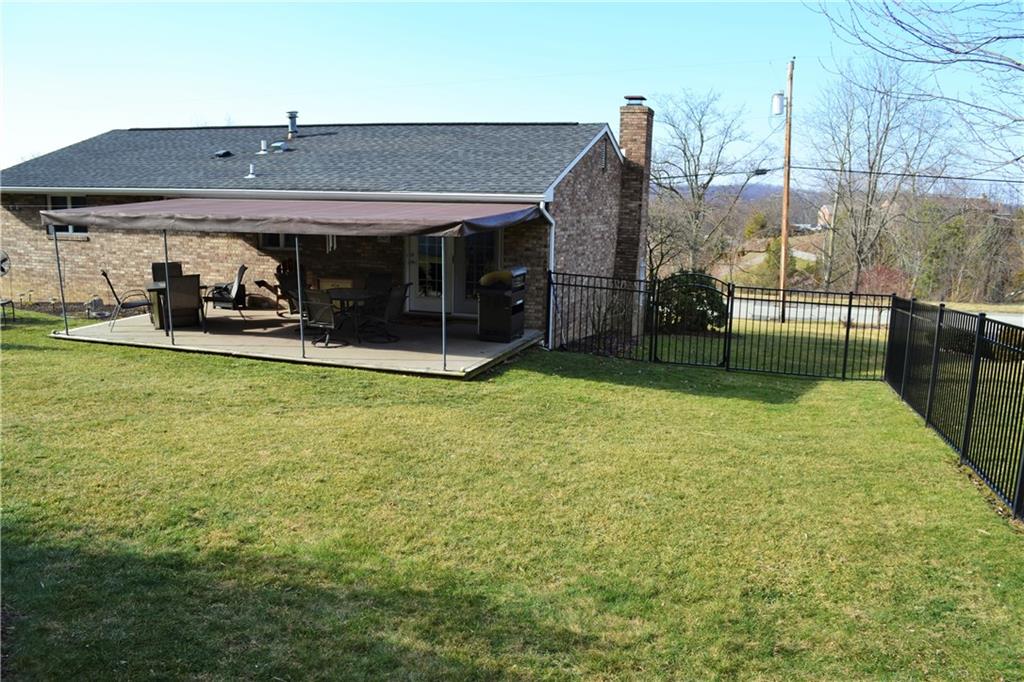 60 Windcrest Drive Cecil, PA 15321 - Photo 24 of 25 Covered deck with awning! New iron fence.