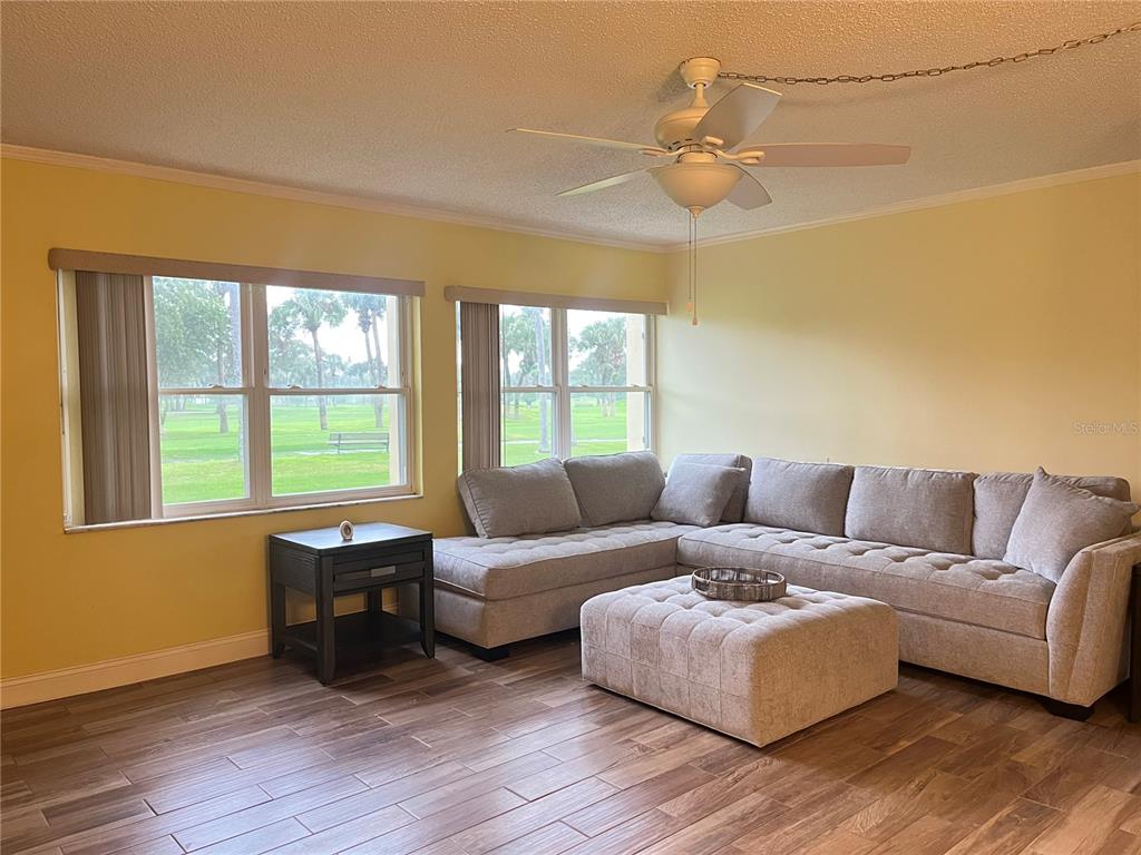 12200 Vonn Road, Unit 2105 Largo, FL 33774 - Photo 11 of 37 a living room with furniture and a window