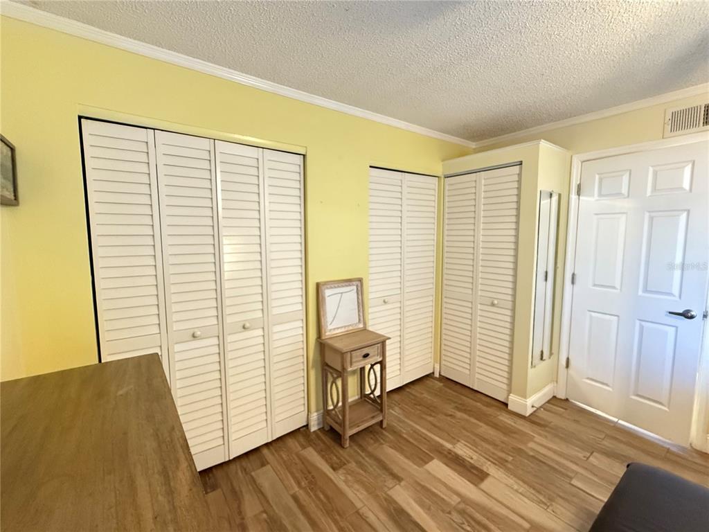 12200 Vonn Road, Unit 2105 Largo, FL 33774 - Photo 26 of 37 a view of a room with wooden floor and windows