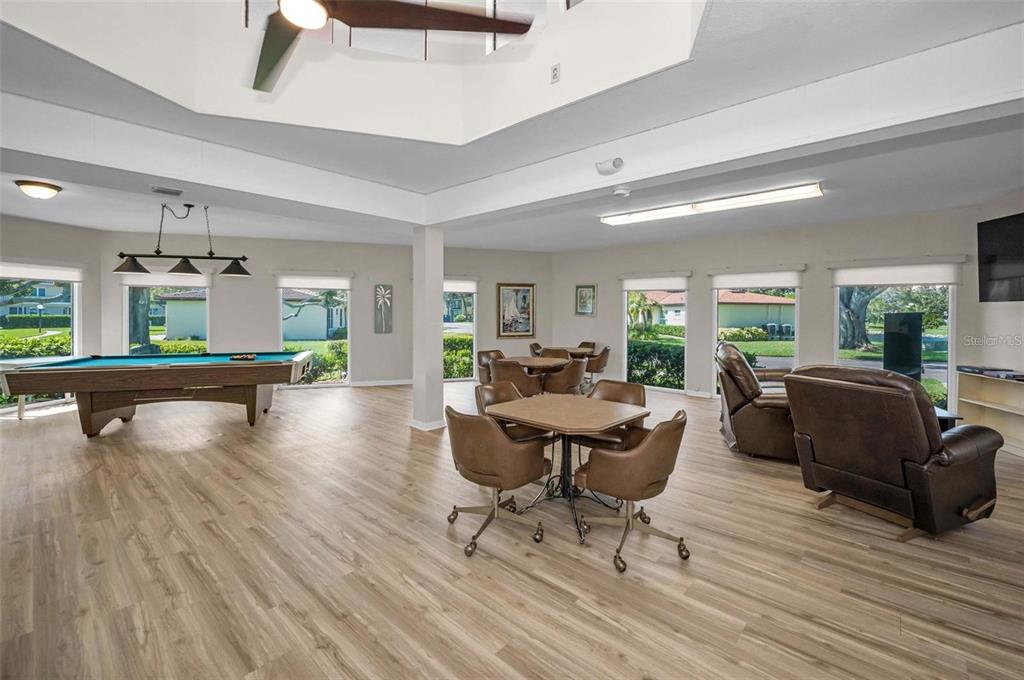 12200 Vonn Road, Unit 2105 Largo, FL 33774 - Photo 32 of 37 a living room with furniture and a wooden floor