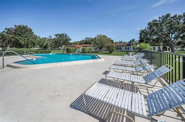 a view of balcony with wooden floor and fence