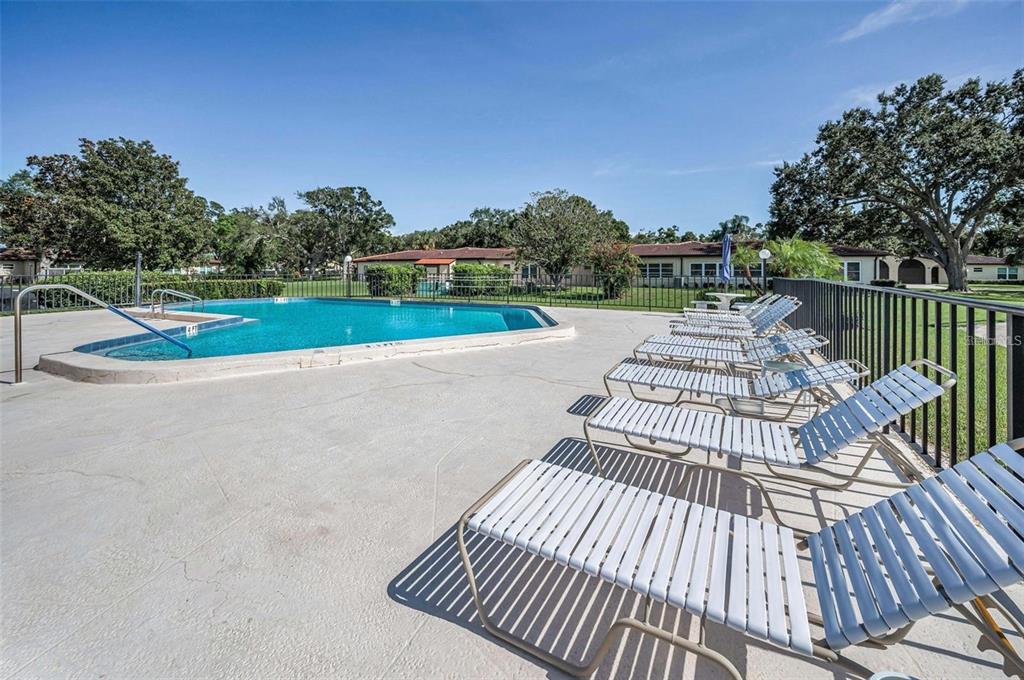 12200 Vonn Road, Unit 2105 Largo, FL 33774 - Photo 5 of 37 a view of balcony with wooden floor and fence