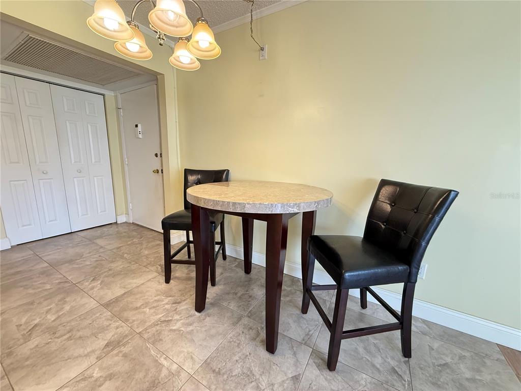 12200 Vonn Road, Unit 2105 Largo, FL 33774 - Photo 10 of 37 a view of a livingroom with furniture and chandelier