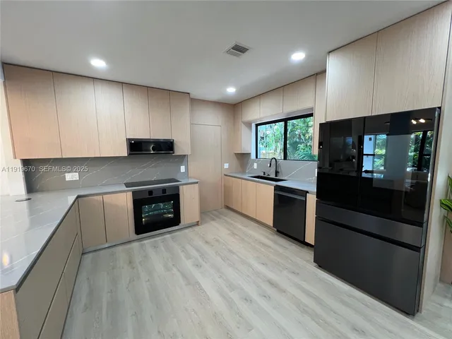 a view of swimming pool with seating area and trees around