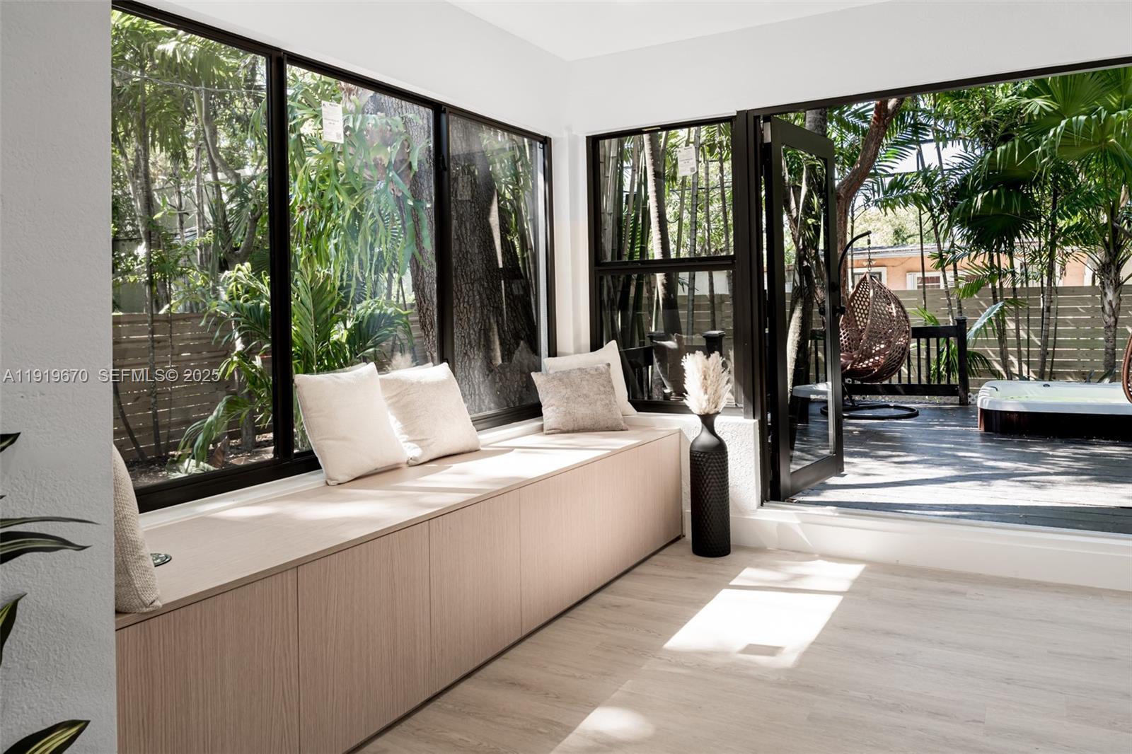 751 Northeast 80th Street Miami, FL 33138 - Photo 19 of 32 a living room with furniture and large windows